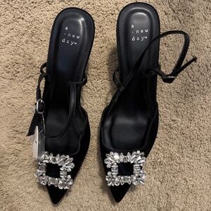 Black kitten heel with fancy brooch